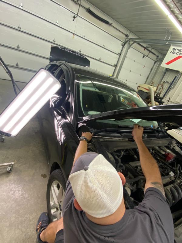 Person working on car